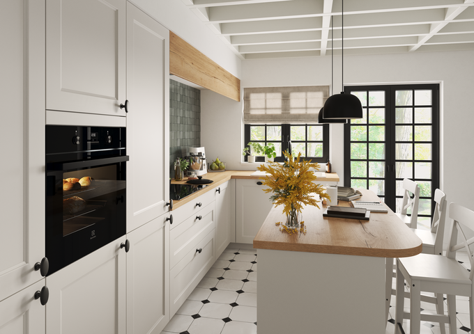 Cocina blanca madera con isla central, horno empotrado negro, encimera de madera